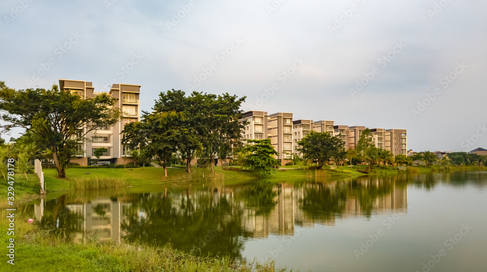 Tangerang, Indonesia - 7th June 2019: Rainbow Springs Condo Villa, a luxury apartment complex, next to a lake, in Gading Serpong residential area. It is an area with high property development.