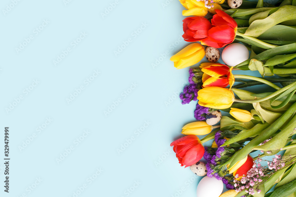 Springtime season greeting card - happy easter concept - multicolored tulips and eggs on bright blue background, copy space, sale, discount, celebrate banner