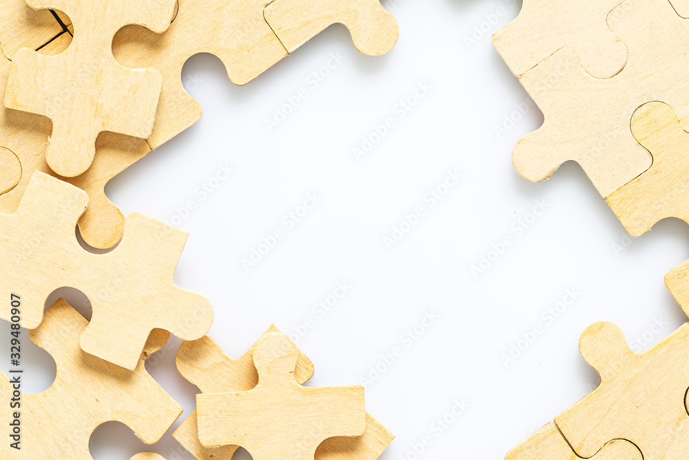 wooden jigsaw puzzle pieces on white background Stock Photo | Adobe Stock