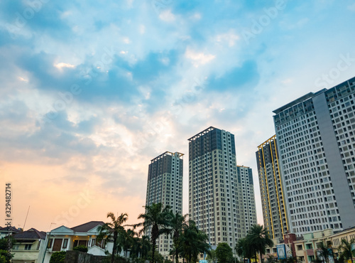 Tangerang, Indonesia - July 2019: Luxury apartments M-Town Residence in Gading Serpong, Tangerang  photographed at sunset with beautiful sky.  © HaniSantosa