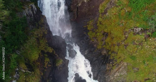 Aerial Rising Crane Shot Following Låtefossen Upstream photo