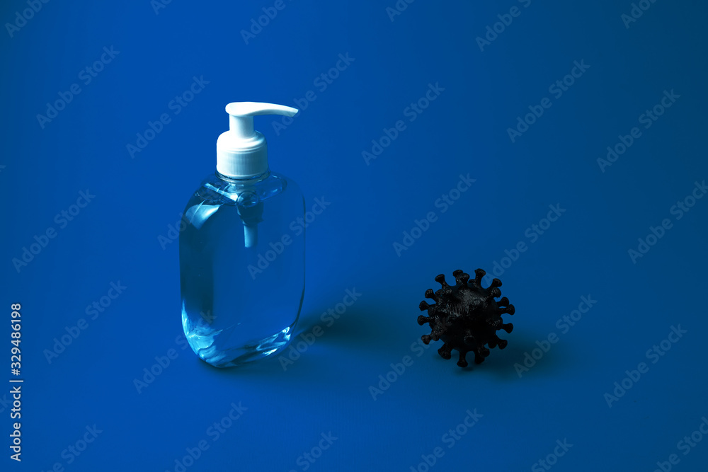 Coronavirus and liquid soap on a blue background. Concept for hospitals, medical centers, laboratories. Copy space Coronavirus and liquid soap on a blue background. Concept for hospitals, medical centers, laboratories. Copy space