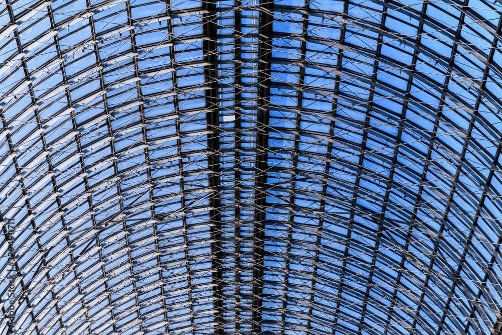 Glass roof of an old shopping center. The design of the glass roof. Abstract texture background. Glass roof of an old shopping center. The design of the glass roof. Abstract texture background.