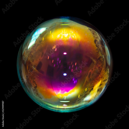 Multicolored soap bubble isolated on a black