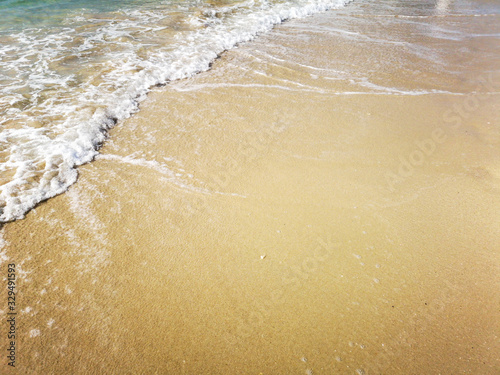 sand and water on the seashore as a background