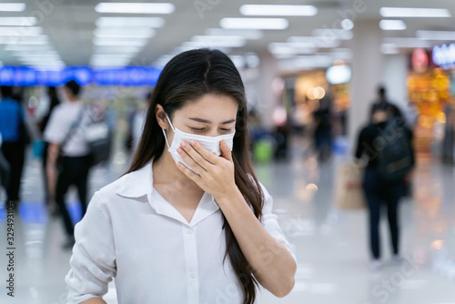 Woman wearing medical mask to protect against coronavirus.