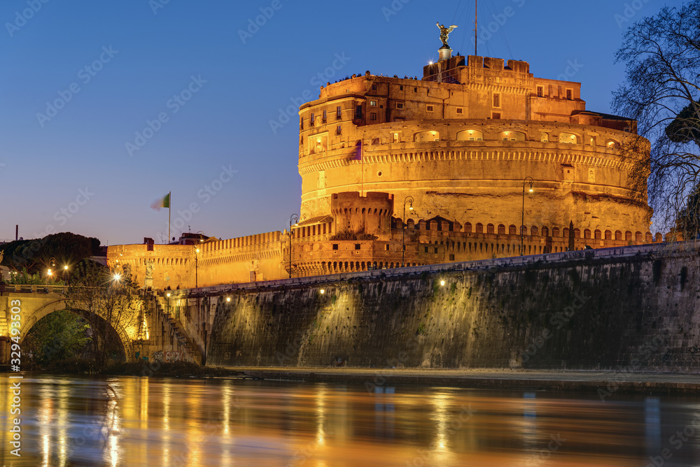 The Castel Sant Angelo and the Tiber river in Rome at night
