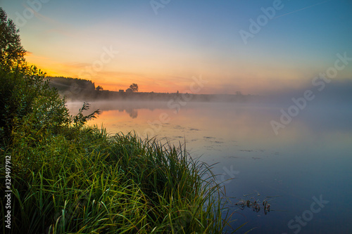 Fototapeta Naklejka Na Ścianę i Meble -  a sunrise at lake