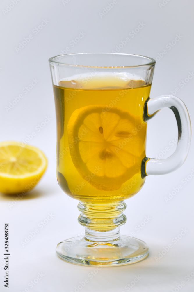 A slice of lemon stuck in a cup of tea A slice of lemon stuck in a cup of tea