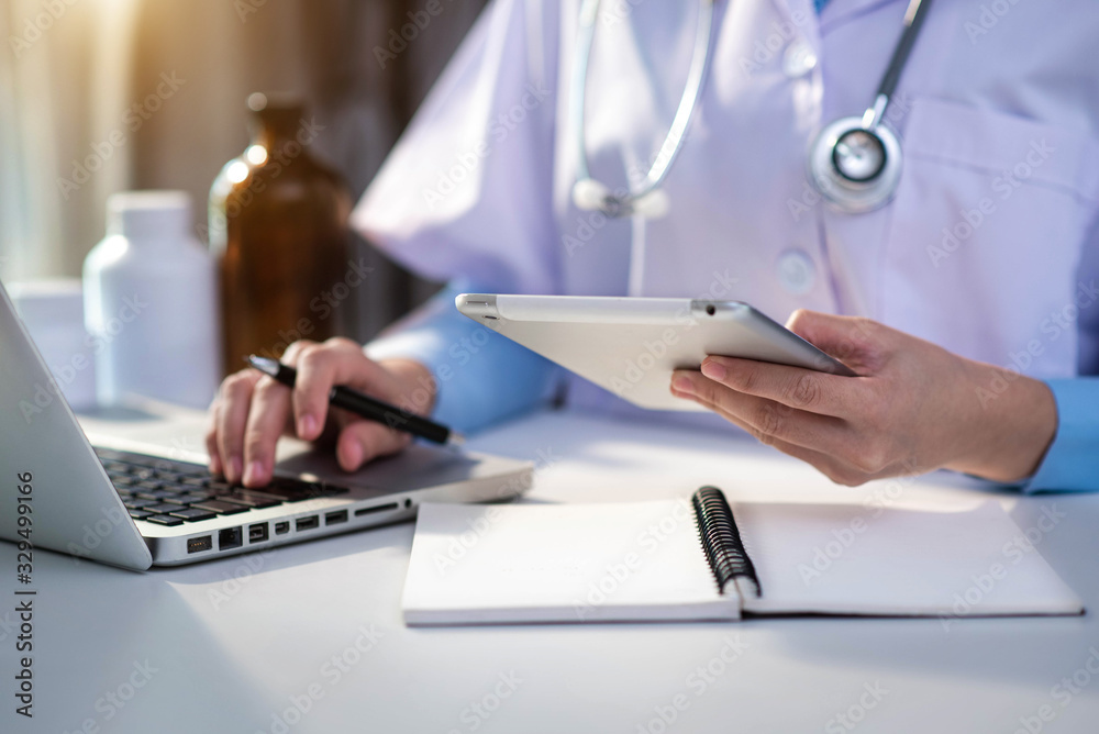Fototapeta premium Medicine doctor hand working with modern digital tablet computer interface as medical network concept .