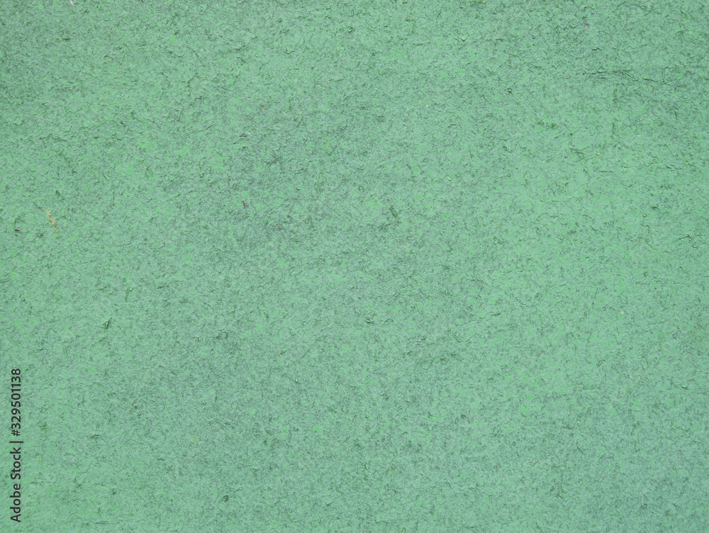 Old green painted cardboard closeup