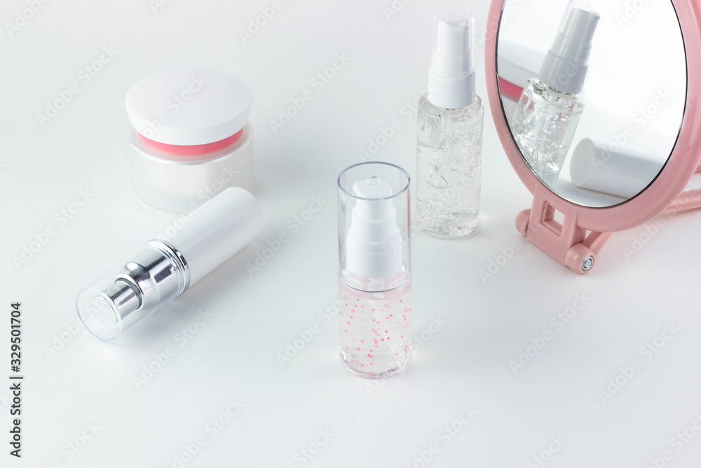 Face care cosmetics. Cosmetic bottles with serum, gel, face cream on a white background.