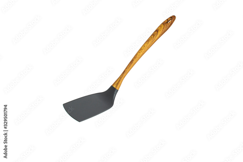 Kitchen spatula made of heat-resistant plastic with a wooden handle. Isolated on a white background.