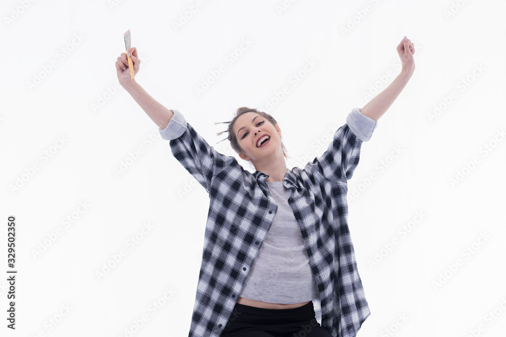 Young artist stretching her arms in a victory gesture Young artist stretching her arms in a victory gesture