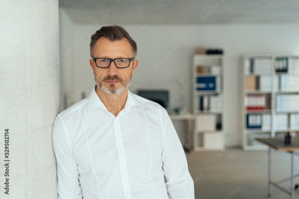 Serious businessman staring intently at the camera Serious businessman staring intently at the camera