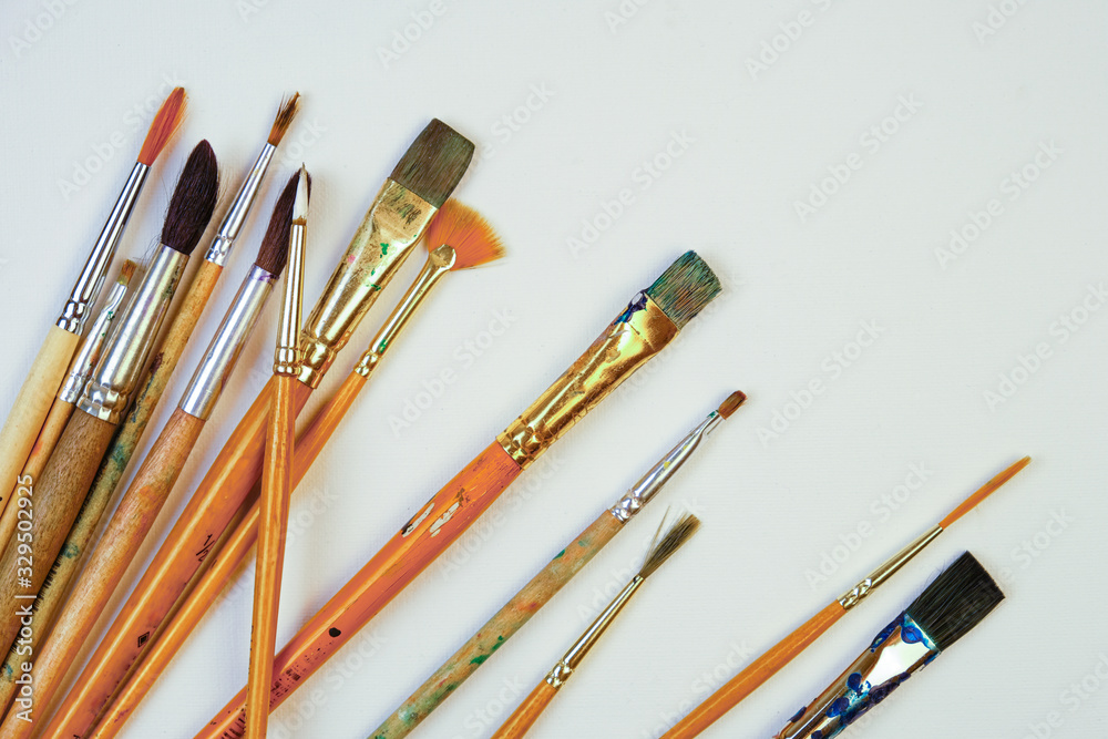 Obraz premium Paint brushes and paints background