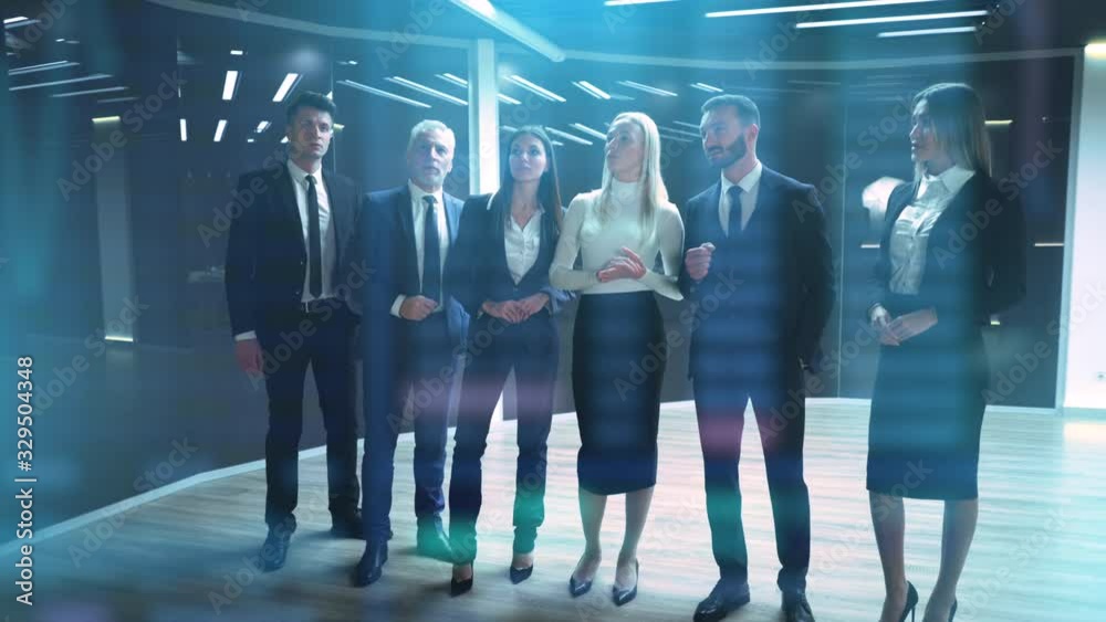 The business group of six working on a virtual holographic screen
