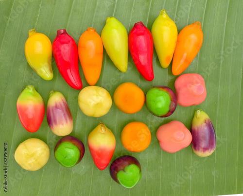 Top view thai dessert Luk Chup on banana leaf photo