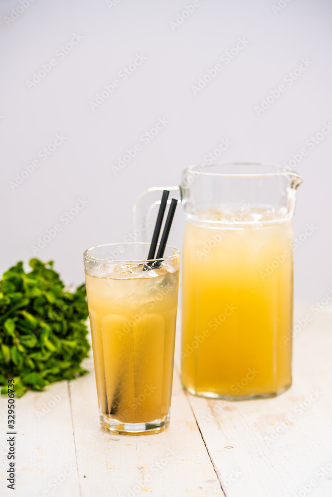 orange juice with ice. juice in a decanter orange juice with ice. juice in a decanter