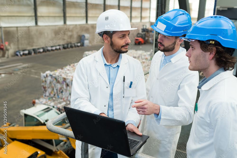 workers at an electronic waste recycling plant