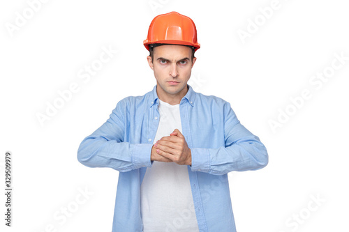 Strong builder, man shows his blow, portrait, isolated background, copy space