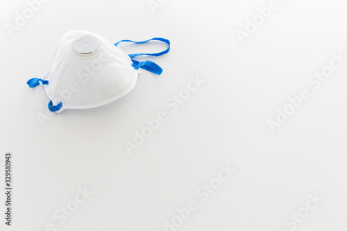 mask for coronavirus protection with copyspace on white background