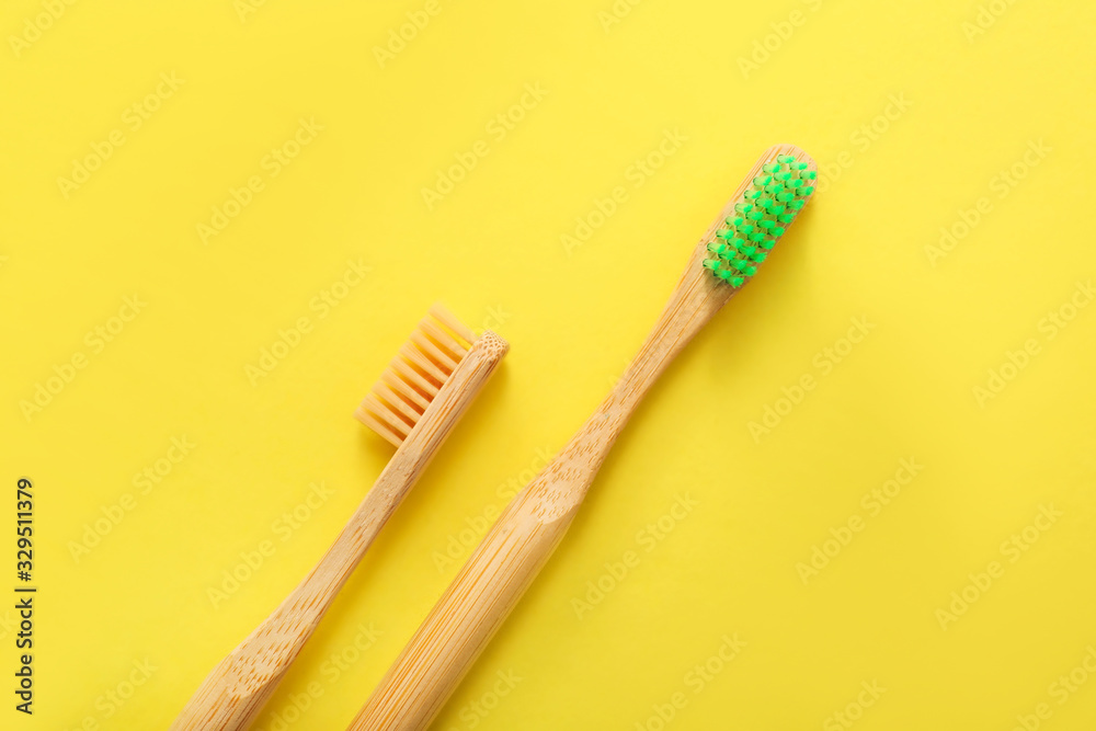 Tooth brushes on color background