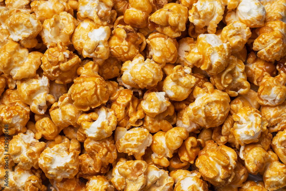 Background texture of popcorn in caramel glaze. Close up. Background texture of popcorn in caramel glaze. Close up.