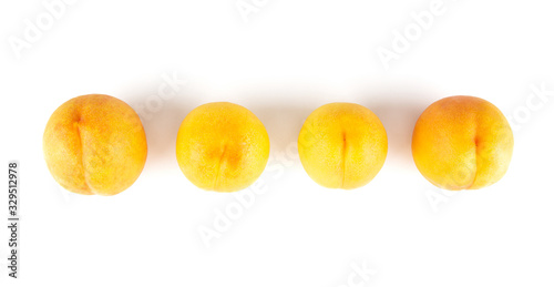 Fresh yellow peach isolated on white background.