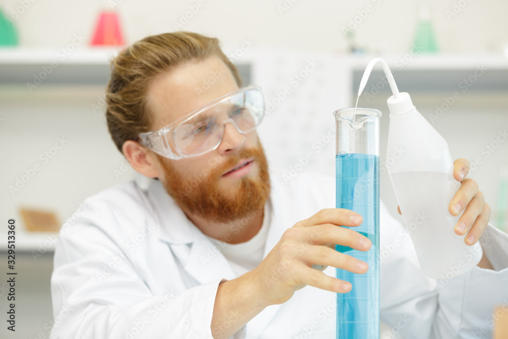 a man checking lab liquids