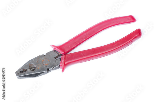 Old pliers with red handle