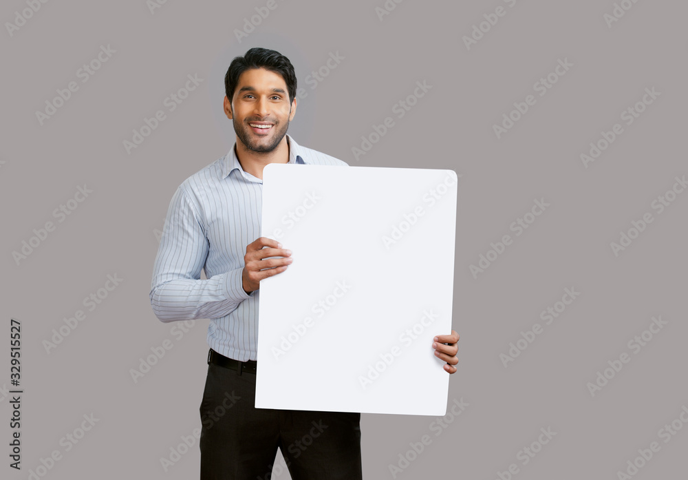 Man holding white square placard in his hand. Man holding white square placard in his hand.