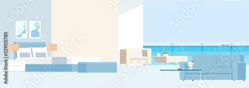 Bedroom with a balcony overlooking the sea and garden furniture.