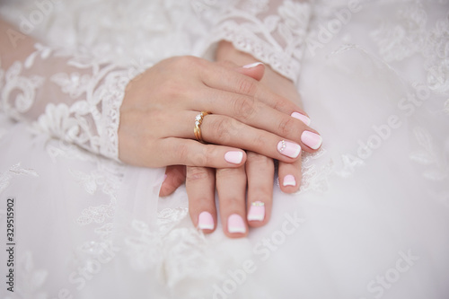 hands of the bride on the wedding day