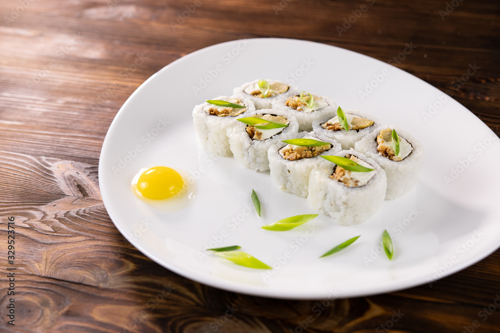 Rolls with eggs and leek on a plate Rolls with eggs and leek on a plate