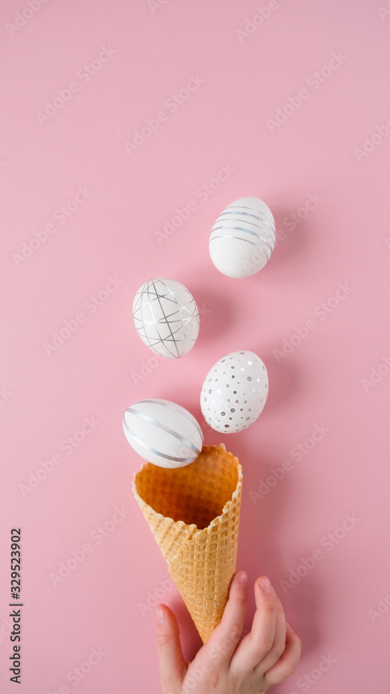 White easter eggs with silver pattern on pink White easter eggs with silver pattern on pink