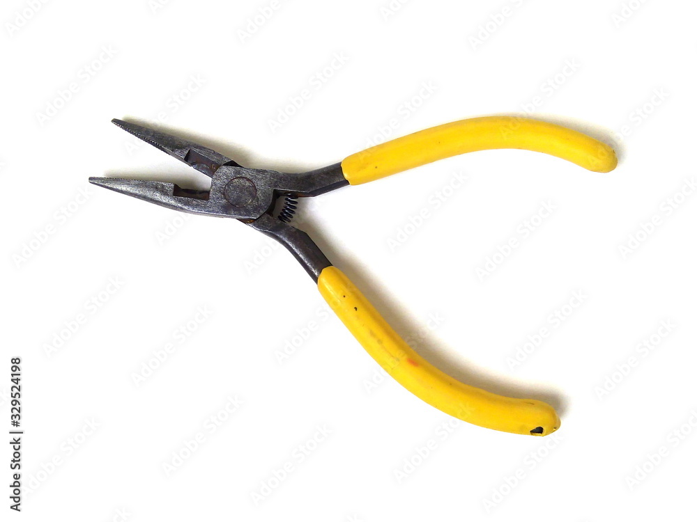 Obraz premium Close up of electrical pliers isolated on white background. Yellow handle pliers. Hand tool.
