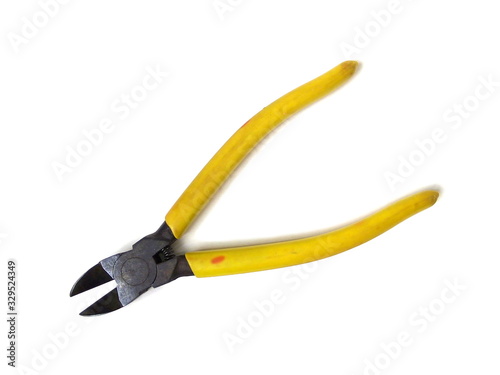 Close up of yellow handle cutting pliers isolated on white background. Old cutting pliers. Rusty cutting pliers. Hand tool.