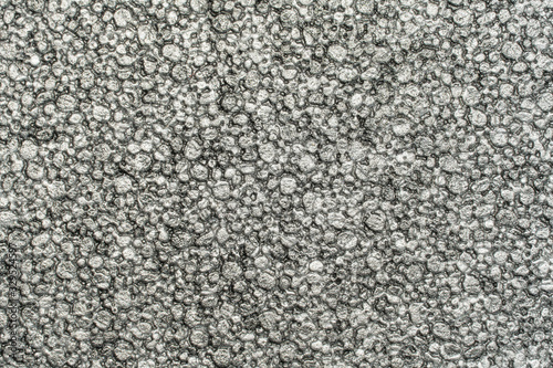 Light grey grunge asphalt texture close up view. 