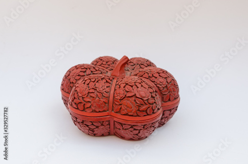 Fotografia Old pumpkin shape cinnabar box from China - isolated on white background