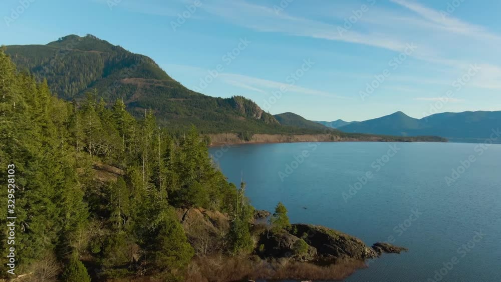 Beautiful Aerial View of Kennedy Lake during a vibrant sunny day. Located on the West Coast of Vancouver Island near Tofino and Ucluelet, British Columbia, Canada. Beautiful Aerial View of Kennedy Lake during a vibrant sunny day. Located on the West Coast of Vancouver Island near Tofino and Ucluelet, British Columbia, Canada.