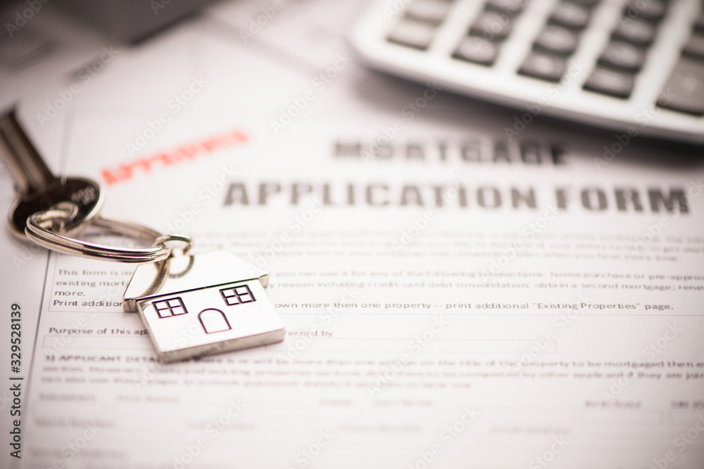 Fototapeta premium An empty mortgage application form with house key business working concepts