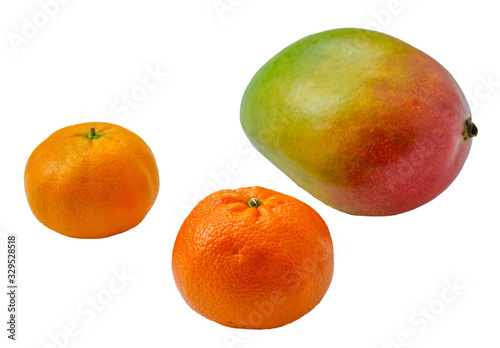 Mango and tangerines closeup. Isolated image. Juicy fruits on a white background.