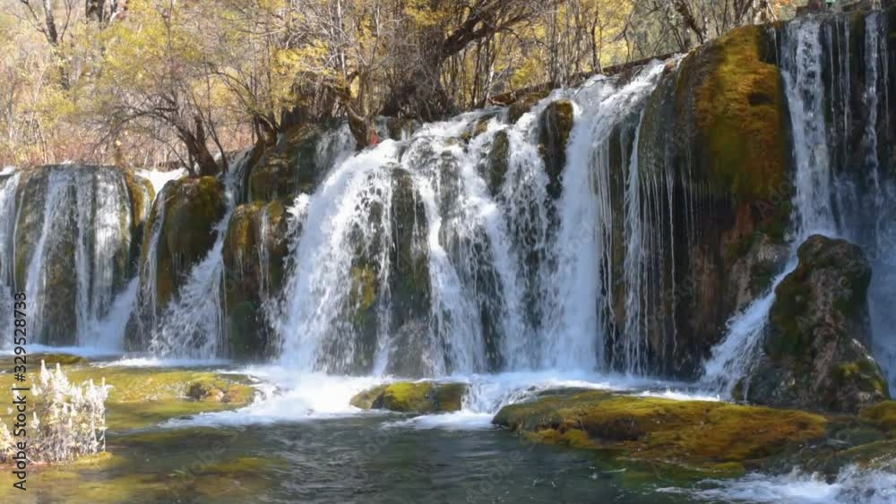 Waterfall and pond with crystal clear water Waterfall and pond with crystal clear water