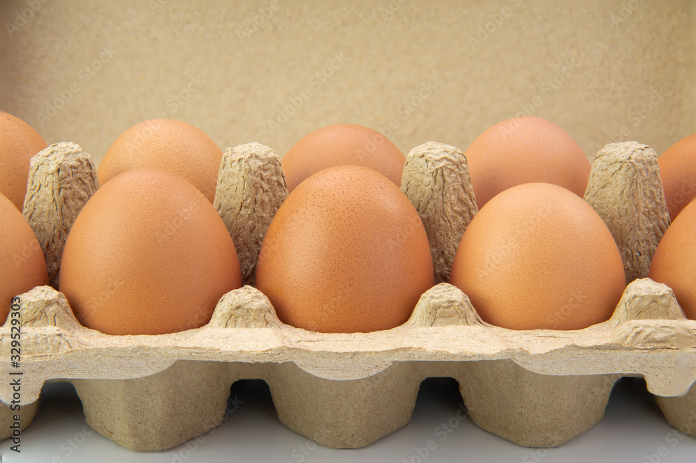 Top view of fresh farm chicken eggs in egg carton box or egg box container