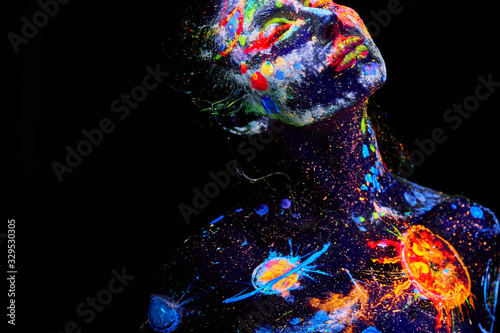 UV painting of a universe on a female body portrait photo
