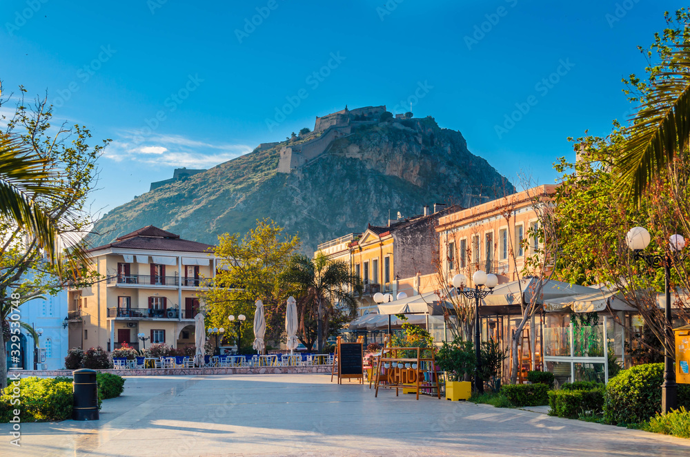 Nafplio Greece- Philellinon square-The historic square of the city located in the old town.The castle of Palamidi in the background.