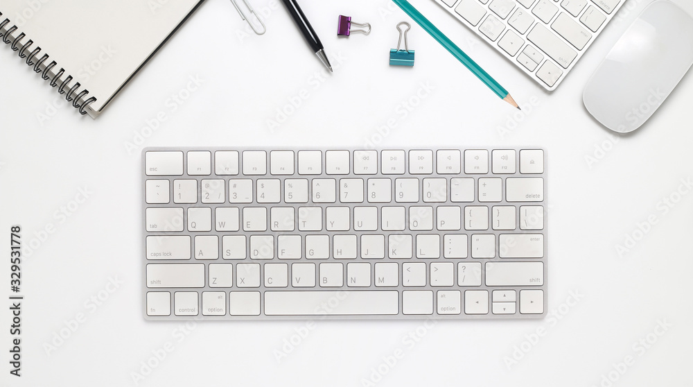 Top view office desk with computer and office supplies isolated on white background Top view office desk with computer and office supplies isolated on white background