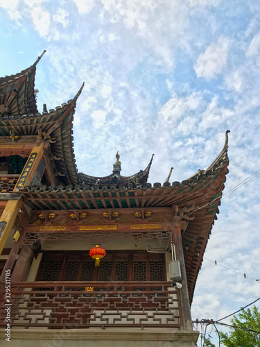 Traditional Asia Chinese architecture garden temple and tower in daytime