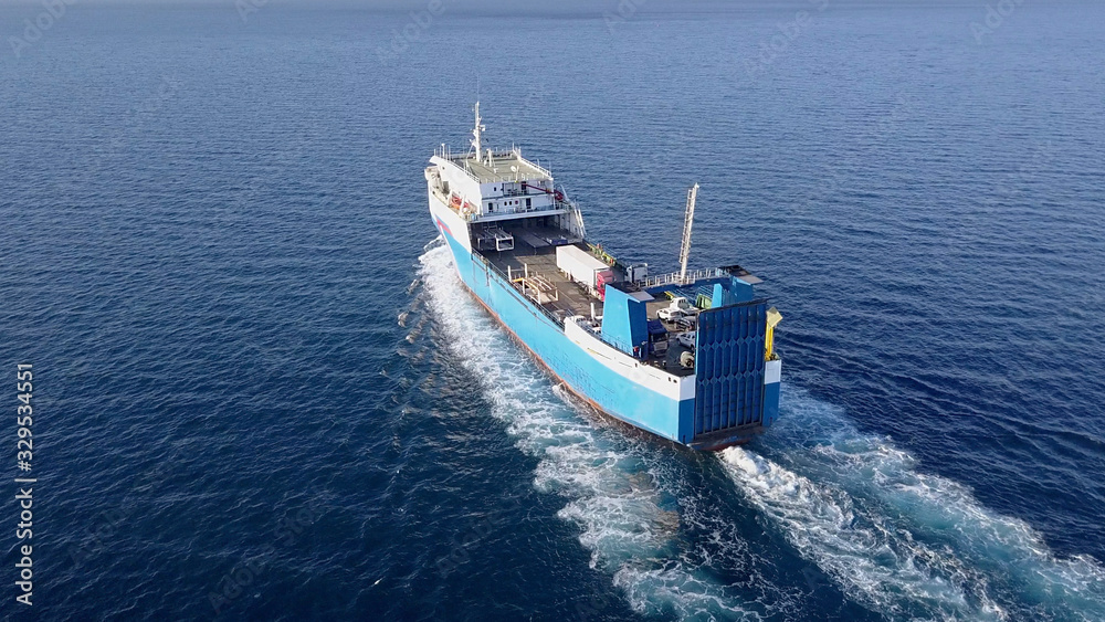 Ro Ro Ship: Aerial view of a medium RoRo Vehicle carrie vessel cruising at sea.